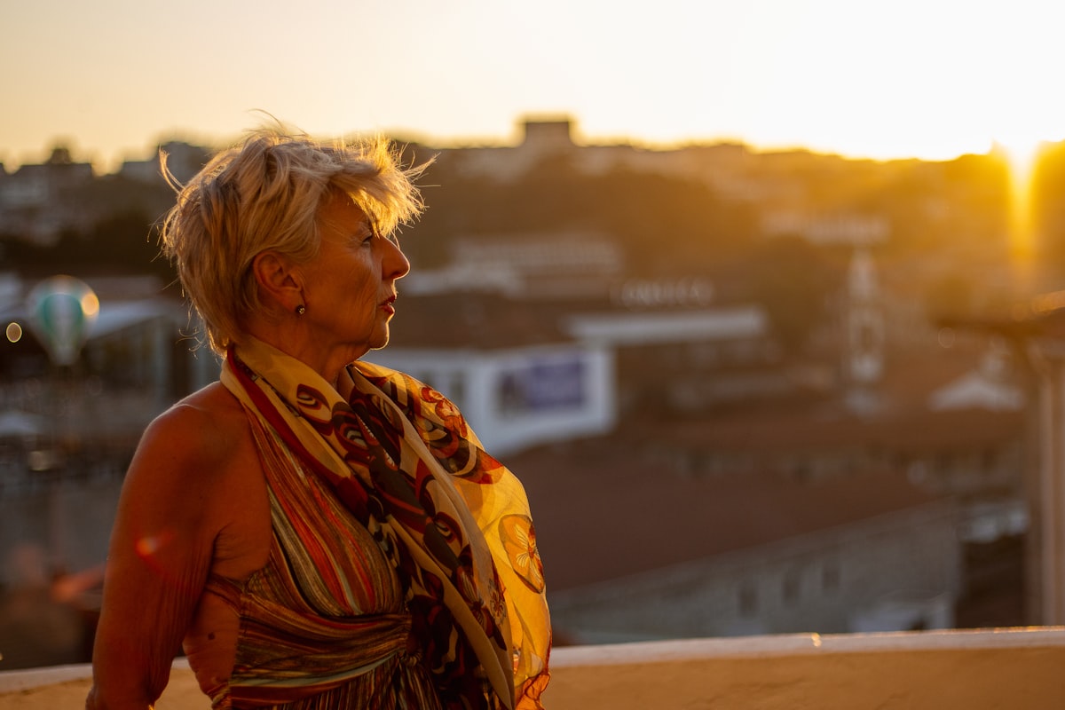 Woman practicing morning energy ritual with sunrise